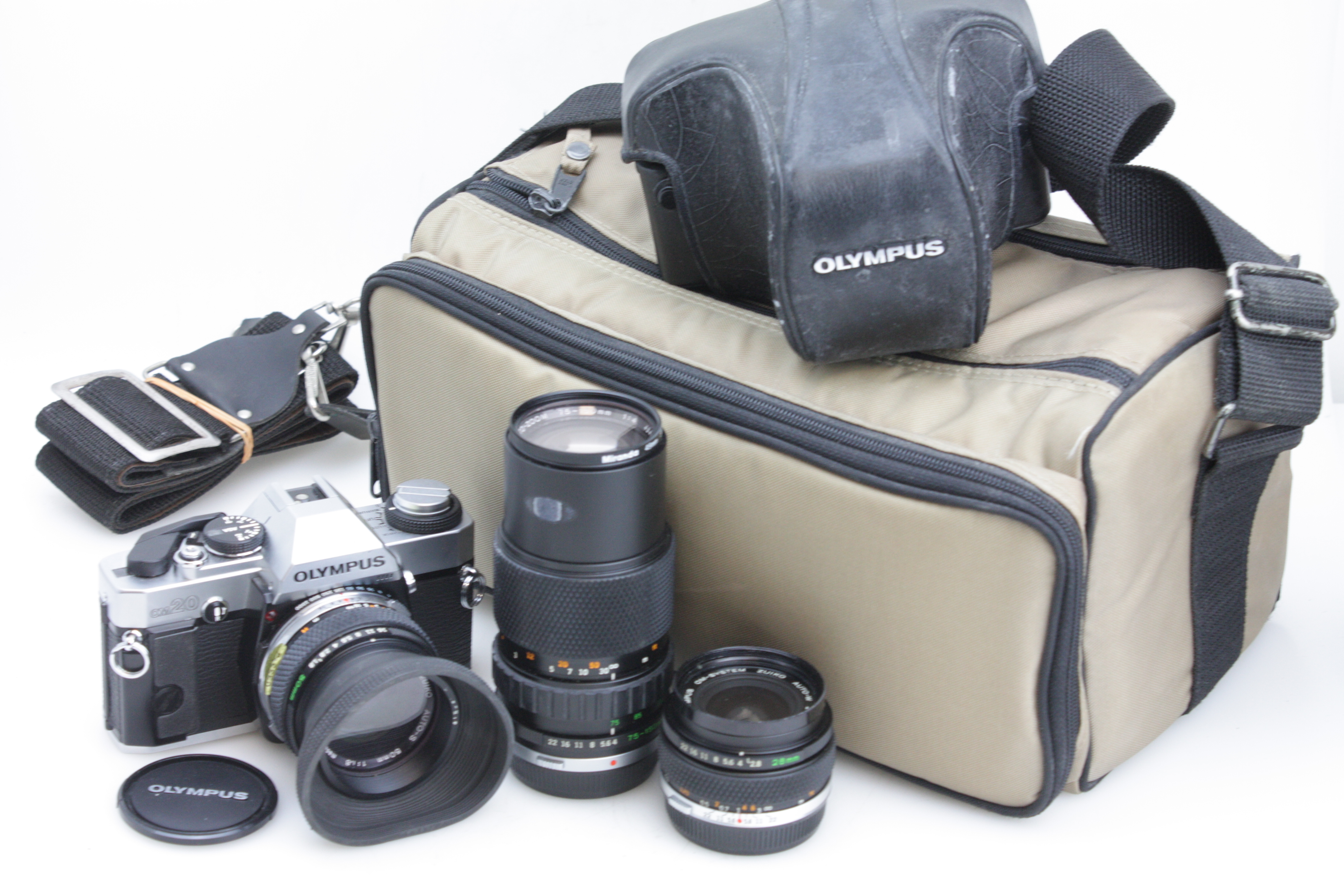 Olympus OM20 35mm film SLR 28/2.8, 50/1.8 & 75-150mm lenses. Case + Instructions